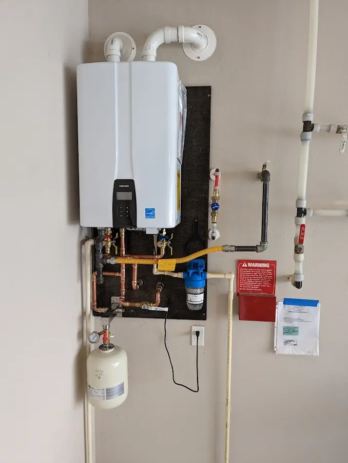 Professional plumber installing copper piping in a Tunkhannock home